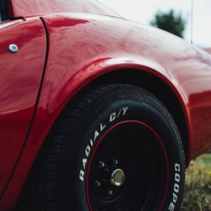 A close up of the wheel on a red car