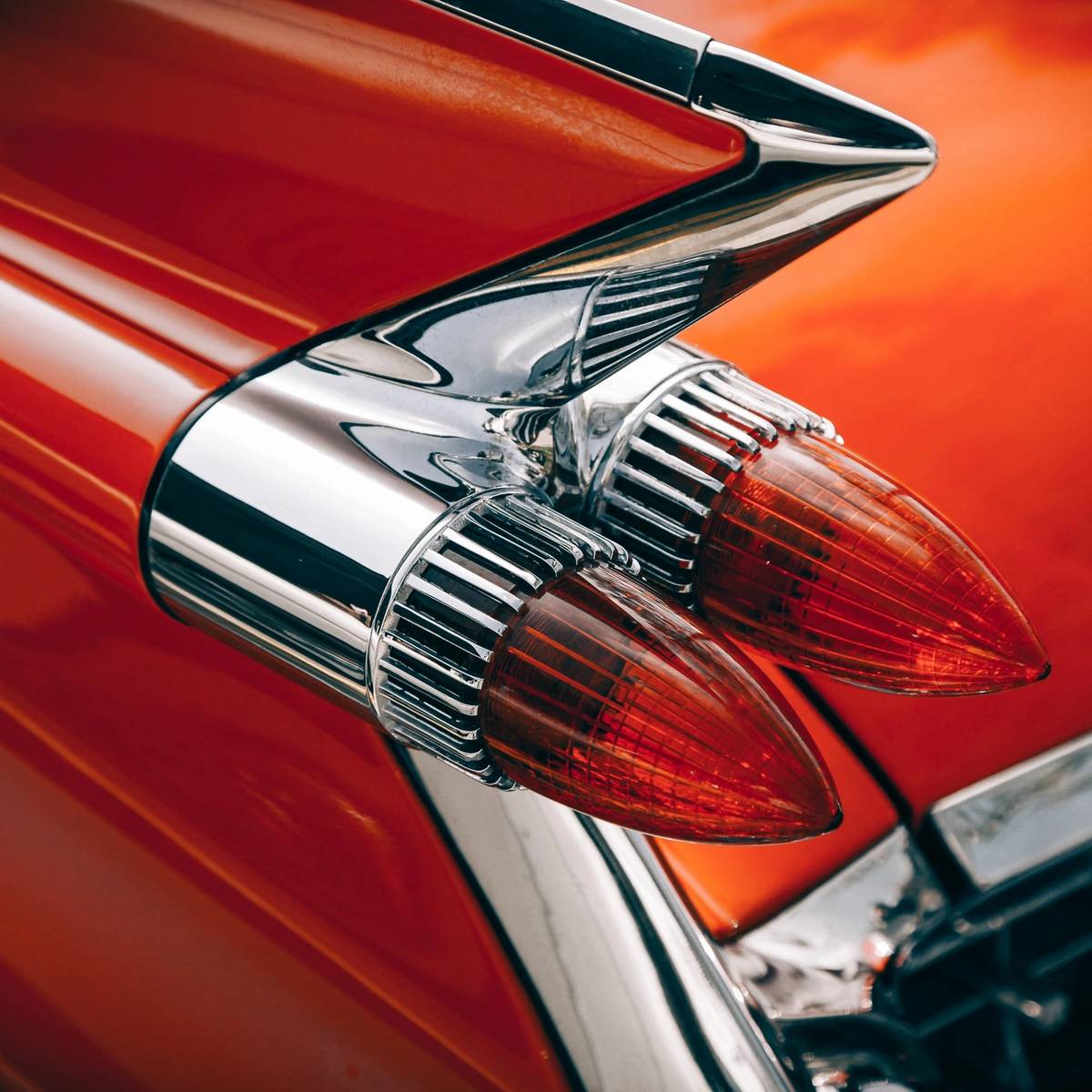 A close up of the tail lights on an old car