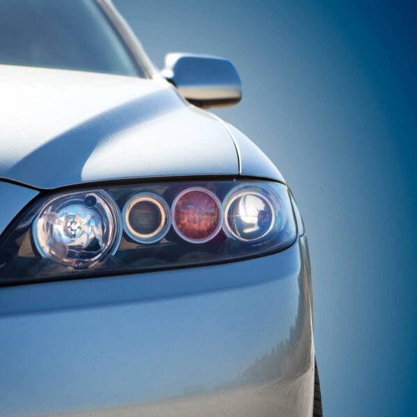 A close up of the front lights on a car