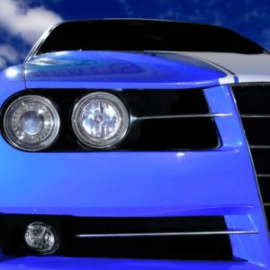 A close up of the front end of a blue car